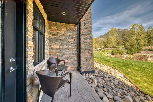 a patio with a table and chairs on a building at Copper Point Resort in Invermere