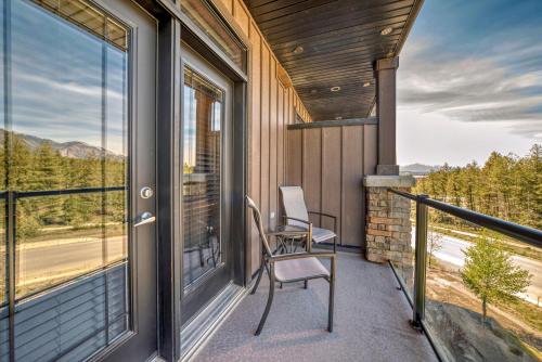 a balcony with a chair and a window at Copper Point Resort in Invermere