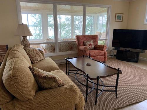 a living room with a couch and a coffee table at Bella Soleil in Traverse City