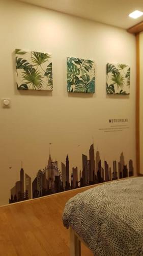 a wall with drawings of a city on it at Loft LINAS in Linas