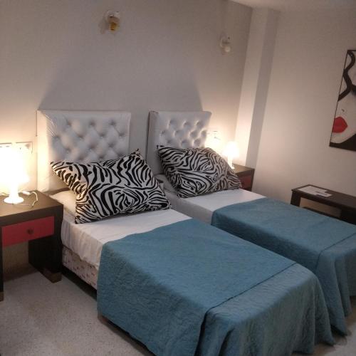 Postel nebo postele na pokoji v ubytování Rosa Ramona Rooms
