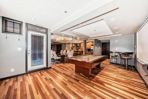a large room with a pool table in it at Copper Point Resort in Invermere