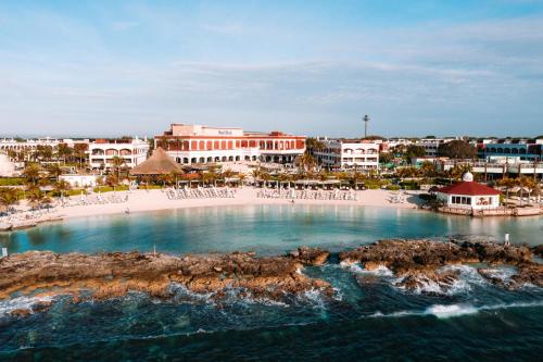 an aerial view of a resort with a beach at Hard Rock Hotel Riviera Maya - All Inclusive in Puerto Aventuras
