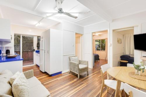 a living room with a couch and a table at Tondio Terrace Flat 3 - Pet Friendly in Gold Coast