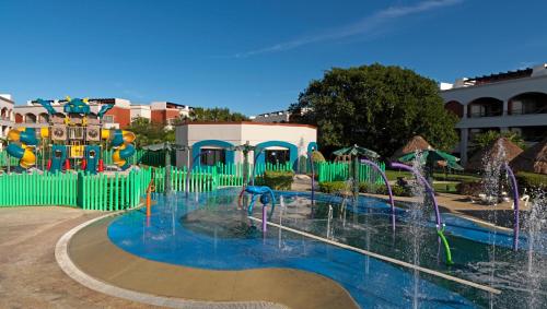 a water park with a water fountain at Hard Rock Hotel Riviera Maya - All Inclusive in Puerto Aventuras