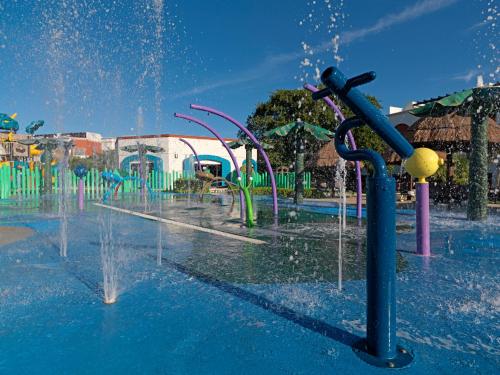 a water park with a water fountain at Hard Rock Hotel Riviera Maya - All Inclusive in Puerto Aventuras