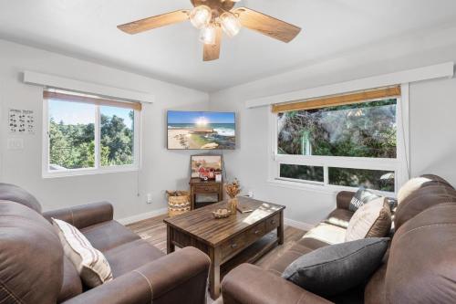 a living room with couches and a ceiling fan at Julian Cafe Cottages With Breakfast At The Julian Cafe in Julian