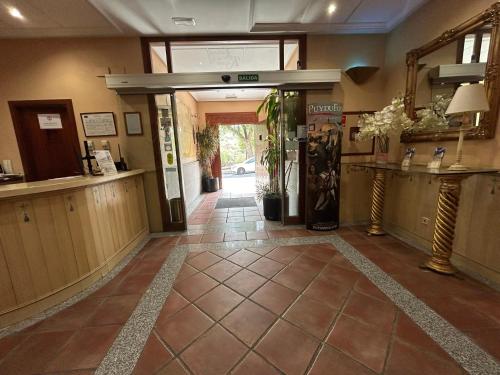 a lobby with a hallway with a lobby at Hotel Casona de la Reyna in Toledo