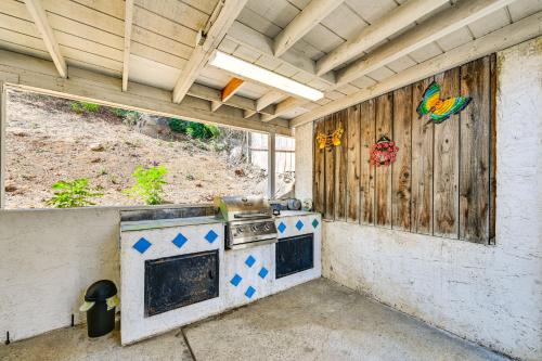 an outdoor kitchen with a stove in a building at San Diego Home AC, Hot Tub, Covered Patio and BBQ in Spring Valley