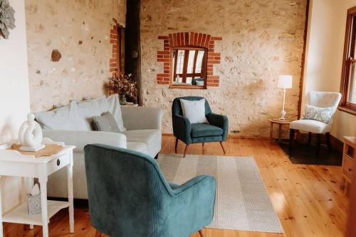a living room with a couch and two chairs at Cole-Brook New Cottage - McLaren Vale in McLaren Vale