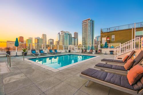 a pool on the roof of a building at Downtown Escape - 2BR w Skyline Views & Hot Tub in Los Angeles