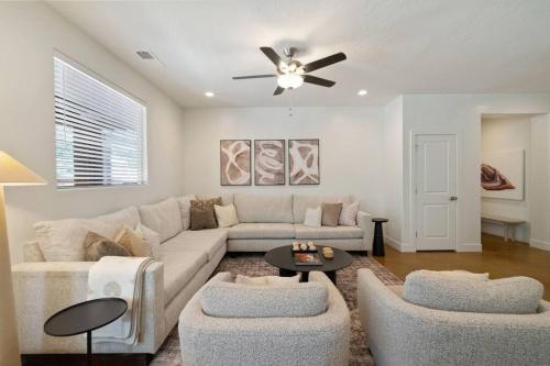 a living room with a couch and a ceiling fan at Retreat, Zion view, Hot Tub, RV Parking, 27 miles Zion in Apple Valley