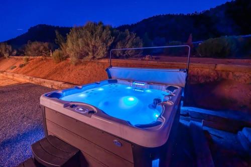 a bath tub sitting on top of a dirt field at Retreat, Zion view, Hot Tub, RV Parking, 27 miles Zion in Apple Valley