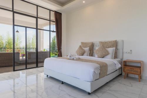 Katil atau katil-katil dalam bilik di The Hacienda Lovina