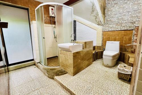 a bathroom with a toilet and a shower and a sink at The Cascade - Mae Taeng Waterfall Bungalows in Ban Mae Ta Man (1)