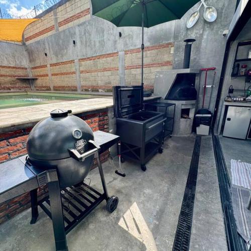a large pot sitting on a grill in a kitchen at Casa Ohana Morelos in Tlayacapan