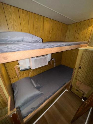 an overhead view of a bunk bed in a boat at De Las Santas Camper in Cabo Rojo