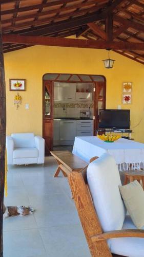a living room with a couch and a table at Espaço Bem Bom in Andaraí