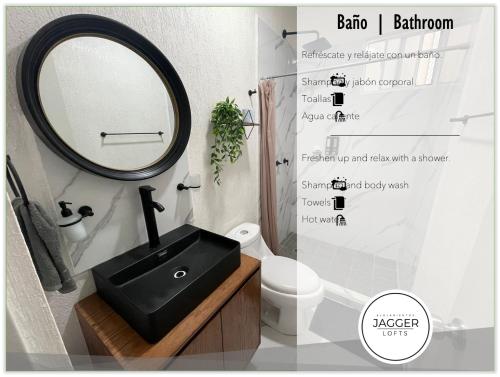 a bathroom with a black sink and a mirror at Loft Joe con WiFi y Alberca in Tulum