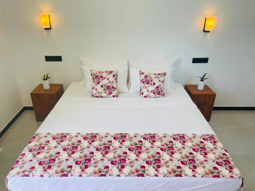 Postel nebo postele na pokoji v ubytování Randon Resort Mirissa