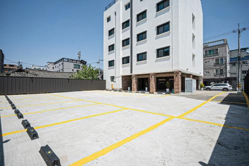 an empty parking lot in front of a building at Elegance hotel hwangridan in Gyeongju