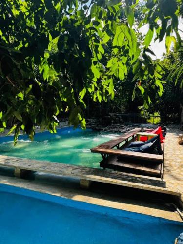 a boat sitting on top of a pool of water at อิงภูเมาท์เท่นวิว เขาใหญ่ in Ban Khan Takhian