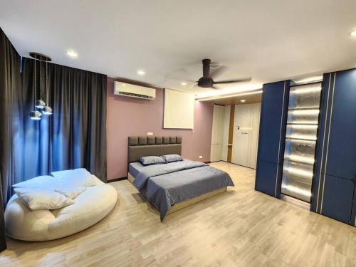 a bedroom with a large bed and a large ottoman at 5min to juru & bukit minyak industrial semi D in Bukit Mertajam
