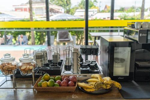 a bunch of fruit on a counter in a kitchen at Book a Bed Poshtel - SHA Plus in Phuket Town