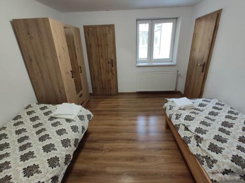 Postel nebo postele na pokoji v ubytování Apartmany Tatra Relax, Velky Slavkov