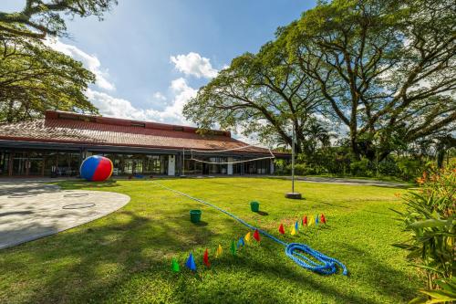 a yard with a large ball and a building at Quest Plus Conference Center, Clark in Clark
