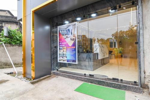 a window of a store with a sign in it at FabHotel JP - Nr Sataragachhi Railway Station in Hāora