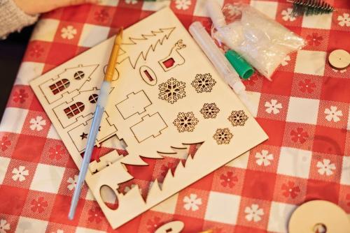 a table with a christmas card on a red and white table cloth at Hiba Luxury Lodge At Parkdean Cayton Bay Holiday Park in Scarborough
