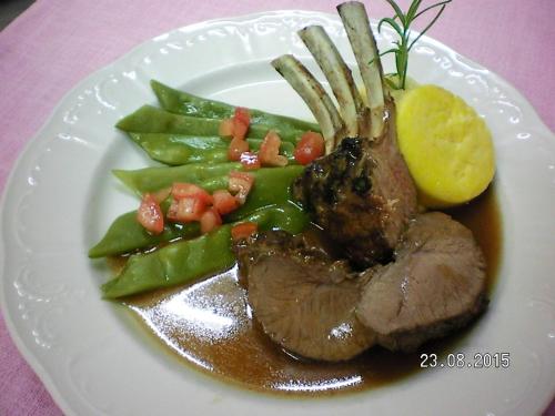 a plate of food with meat and vegetables on a table at Gasthof Geierwallihof Klotz Konrad KEG in Vent