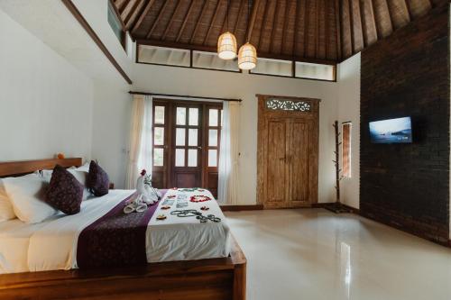 Кровать или кровати в номере The Iyang Ubud