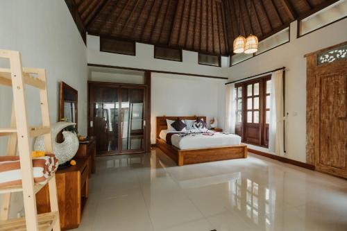 Кровать или кровати в номере The Iyang Ubud
