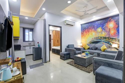a living room with a couch and a table at Hotel The Rasa at Vasundhara in Ghaziabad