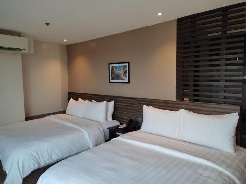 Postel nebo postele na pokoji v ubytování Hotel Inigo