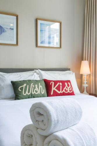 a hotel room with a bed with towels on it at Beach Front Condo, Baan Thew Talay, Perfect Choice for Family and Couple in Ban Bo Khaem