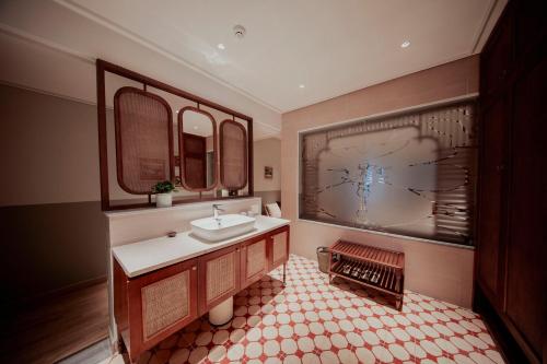 a bathroom with a sink and a mirror at Au Lac Boutique Hotel in Ho Chi Minh City