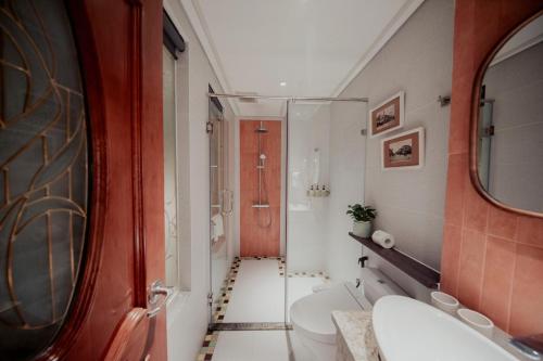 a bathroom with a toilet and a sink at Au Lac Boutique Hotel in Ho Chi Minh City