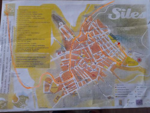 a map of a city on a menu at Casa Los Pinos in Siles