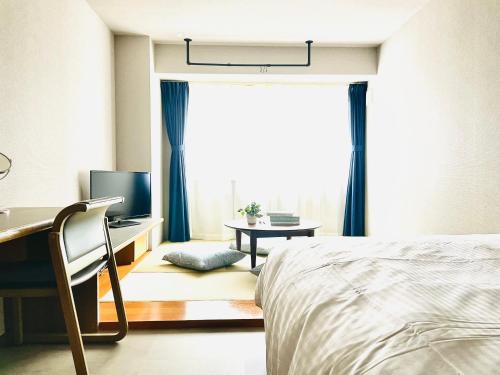 Ένα ή περισσότερα κρεβάτια σε δωμάτιο στο Alphabed HAKATA COMFORT