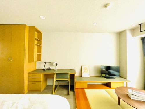 Ένα ή περισσότερα κρεβάτια σε δωμάτιο στο Alphabed HAKATA COMFORT