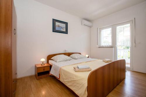 Postel nebo postele na pokoji v ubytování Apartments Mili