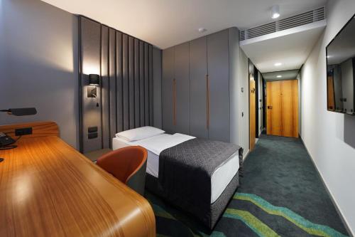 Voodi või voodid majutusasutuse HABAKUK Wellness & Event Hotel toas