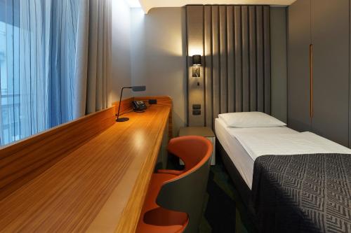 Voodi või voodid majutusasutuse HABAKUK Wellness & Event Hotel toas