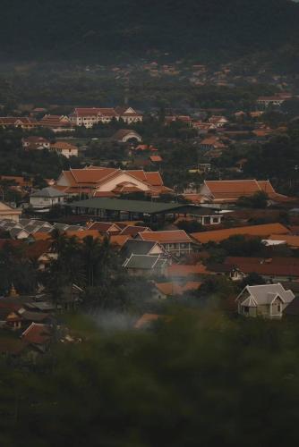 a view of a town with houses and buildings at Moukdavan Guesthouse in Luang Prabang