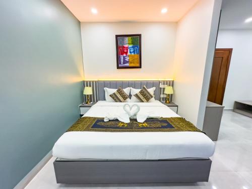Postel nebo postele na pokoji v ubytování C-Hotel