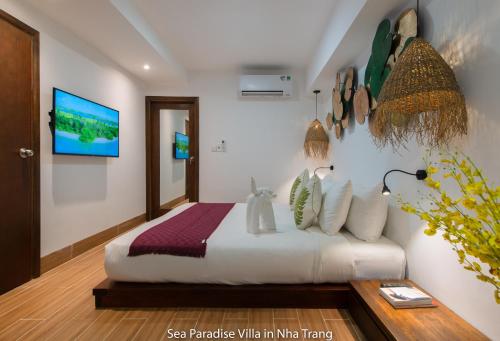 a bedroom with a bed in a room at Anh Nguyen Oceanfront Luxury Villas Nha Trang in Nha Trang