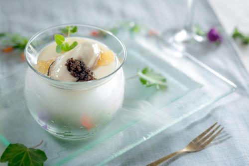 a glass bowl of ice cream on a glass tray at The Parisian Macao in Macau